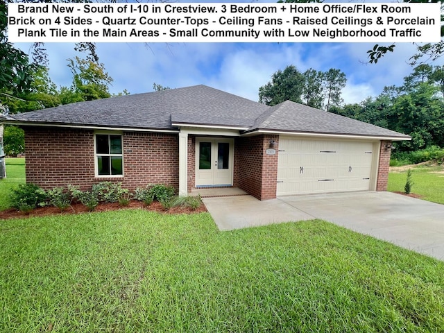 245 Cassady Ln, Crestview, FL 32539 - ranch-style house featuring an attached garage, french doors, a front lawn, concrete driveway, and brick siding