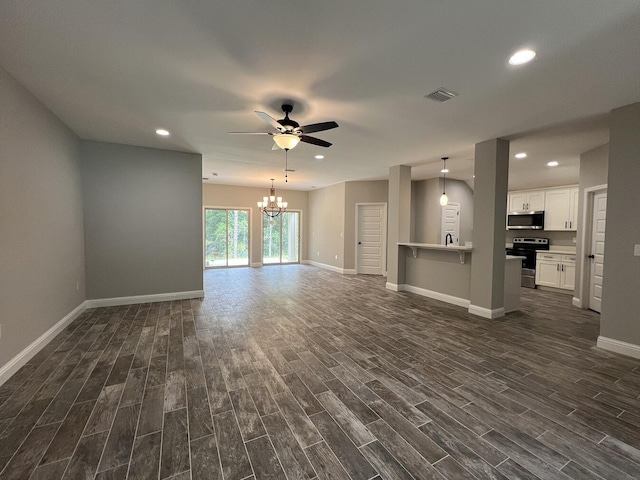 245 Cassady Ln, Crestview, FL 32539 - unfurnished living room with a ceiling fan, dark wood-type flooring, a chandelier, and recessed lighting