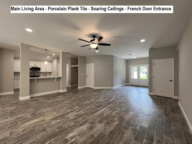 245 Cassady Ln, Crestview, FL 32539 - unfurnished living room featuring dark wood-style flooring, ceiling fan, recessed lighting, and french doors
