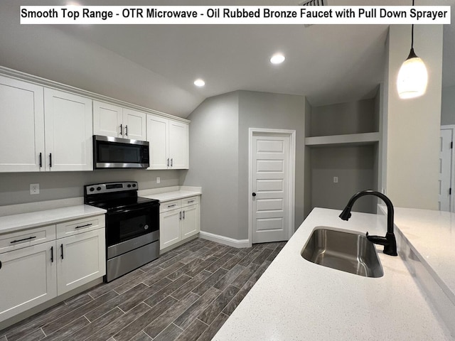 245 Cassady Ln, Crestview, FL 32539 - kitchen featuring stainless steel appliances, white cabinets, vaulted ceiling, recessed lighting, and dark wood-type flooring