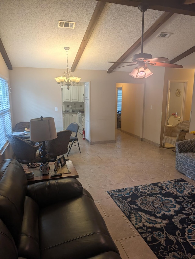 1809 Madelons Path, Fort Walton Beach, FL 32547 - living room with a textured ceiling, a ceiling fan, and a chandelier