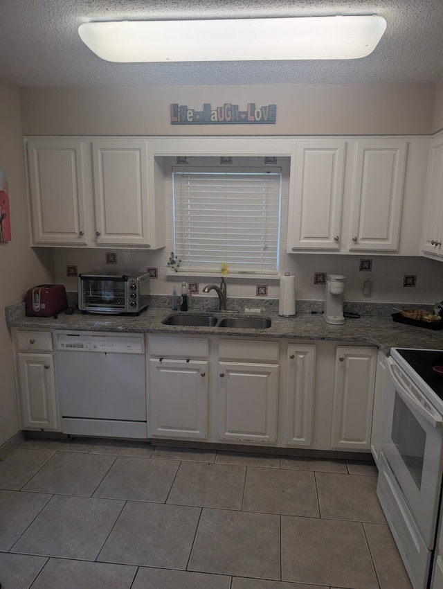 1809 Madelons Path, Fort Walton Beach, FL 32547 - kitchen featuring white appliances, white cabinets, light tile patterned floors, and light stone countertops