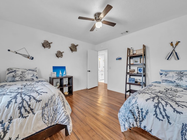 2016 E Three Putt Ln, Panama City, FL 32404 - bedroom with wood finished floors and ceiling fan