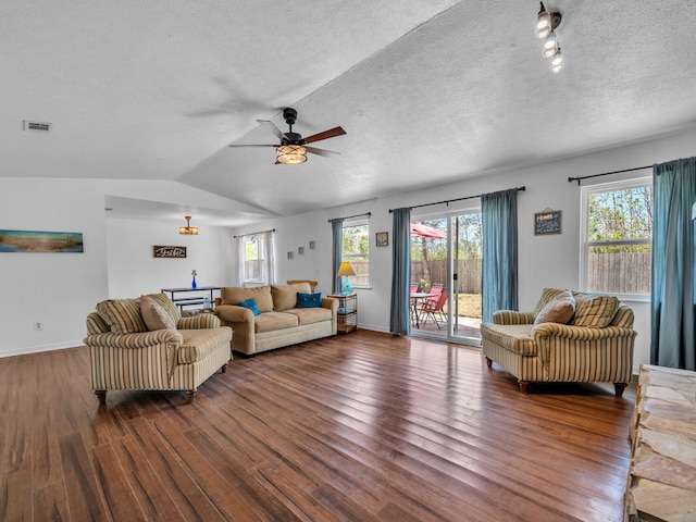 2016 E Three Putt Ln, Panama City, FL 32404 - living area featuring dark wood finished floors, ceiling fan, a textured ceiling, healthy amount of natural light, and lofted ceiling