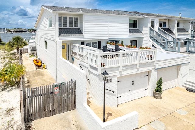 415 Gulf Shore Dr Unit 1, Destin, FL 32541 - rear view of house featuring driveway and a garage