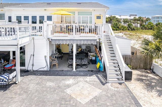 415 Gulf Shore Dr Unit 1, Destin, FL 32541 - back of property with stairway, a patio area, and a deck