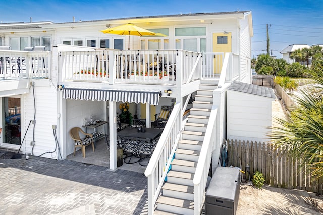 415 Gulf Shore Dr Unit 1, Destin, FL 32541 - back of house with stairway, a patio area, and a deck