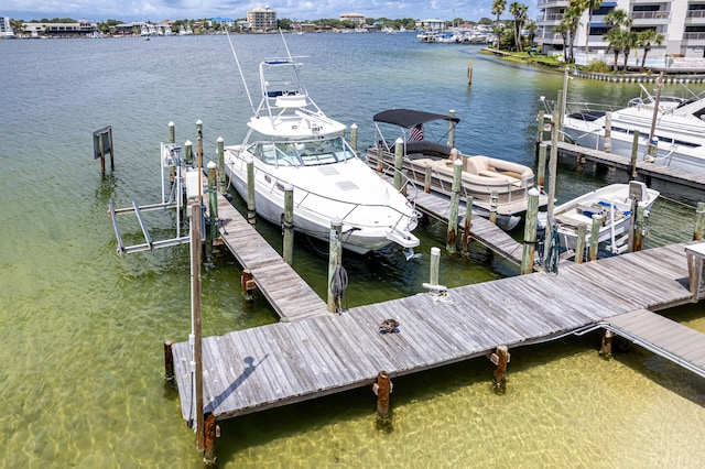 415 Gulf Shore Dr Unit 1, Destin, FL 32541 - dock area featuring boat lift and a water view
