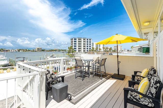 415 Gulf Shore Dr Unit 1, Destin, FL 32541 - wooden terrace with a water view