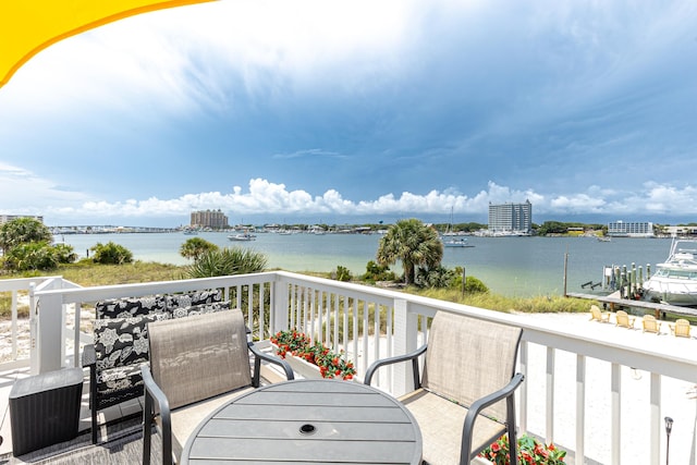 415 Gulf Shore Dr Unit 1, Destin, FL 32541 - balcony with a water view and outdoor dining area