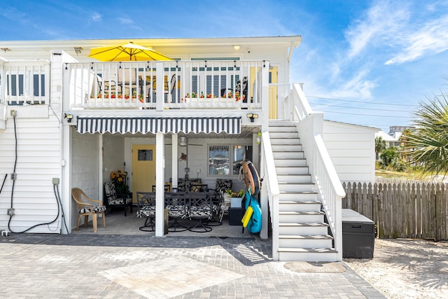 415 Gulf Shore Dr Unit 1, Destin, FL 32541 - back of property featuring stairway, a patio, and a deck