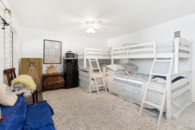 415 Gulf Shore Dr Unit 1, Destin, FL 32541 - bedroom featuring freestanding refrigerator, tile patterned floors, and a ceiling fan