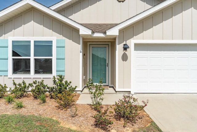 919 Sandbar Loop, Crestview, FL 32539 - property entrance with a garage, a shingled roof, driveway, and board and batten siding