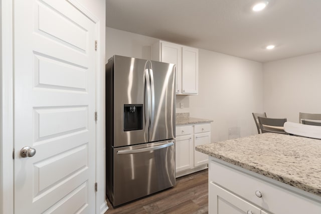 919 Sandbar Loop, Crestview, FL 32539 - kitchen featuring stainless steel fridge with ice dispenser, dark wood finished floors, white cabinetry, light stone countertops, and recessed lighting