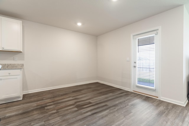 919 Sandbar Loop, Crestview, FL 32539 - unfurnished dining area with dark wood-style flooring and recessed lighting