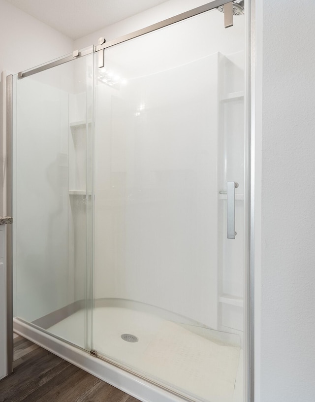 919 Sandbar Loop, Crestview, FL 32539 - bathroom with a stall shower and wood finished floors