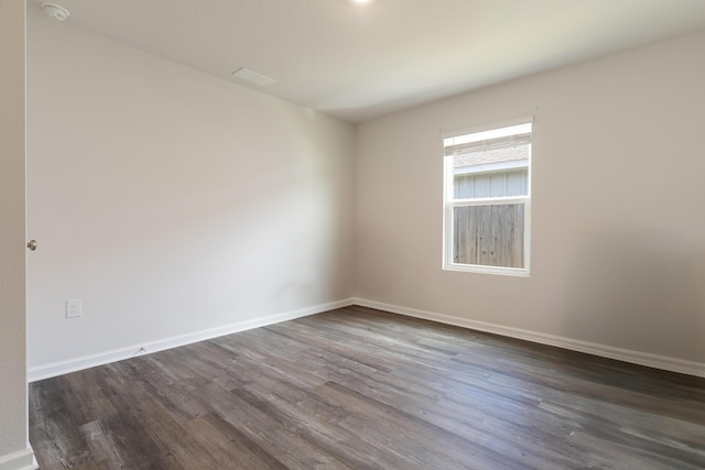 919 Sandbar Loop, Crestview, FL 32539 - unfurnished room with dark wood-style floors and a smoke detector