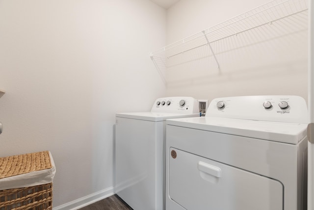 919 Sandbar Loop, Crestview, FL 32539 - washroom with washer and clothes dryer and dark wood-type flooring