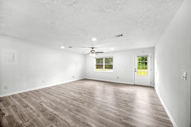 4352 Watkins St, Pace, FL 32571 - unfurnished room with dark wood-style floors, a textured ceiling, a ceiling fan, and recessed lighting
