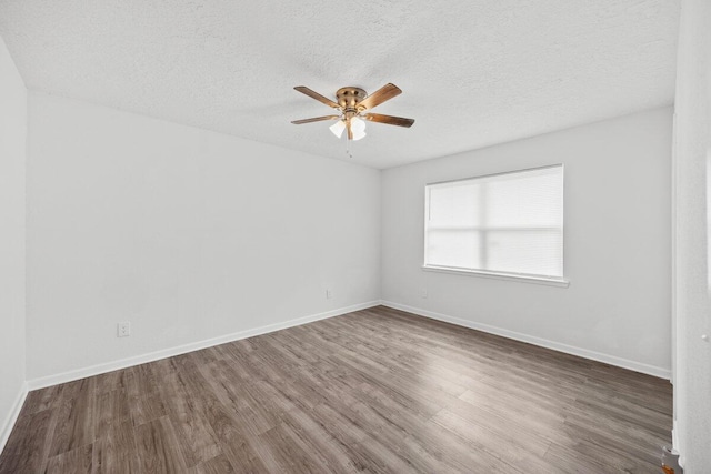 4352 Watkins St, Pace, FL 32571 - unfurnished room featuring a ceiling fan, wood finished floors, and a textured ceiling
