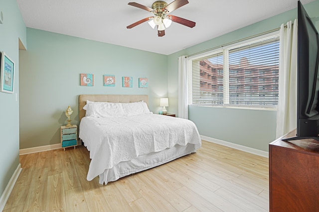 9900 S Thomas Dr Unit 2015, Panama City Beach, FL 32408 - bedroom featuring wood finished floors and a ceiling fan