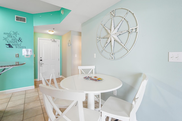 9900 S Thomas Dr Unit 2015, Panama City Beach, FL 32408 - dining room featuring light tile patterned floors and baseboards