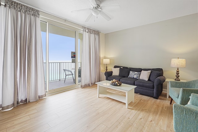 9900 S Thomas Dr Unit 2015, Panama City Beach, FL 32408 - living room with a ceiling fan and light wood-type flooring