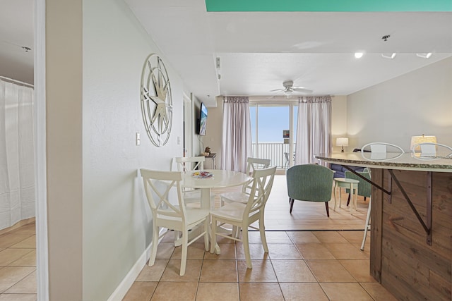 9900 S Thomas Dr Unit 2015, Panama City Beach, FL 32408 - dining area with light tile patterned floors and ceiling fan