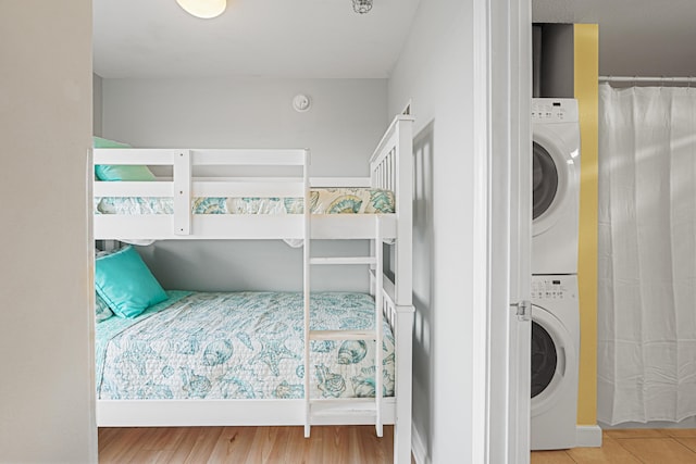 9900 S Thomas Dr Unit 2015, Panama City Beach, FL 32408 - bedroom featuring estacked washer and dryer