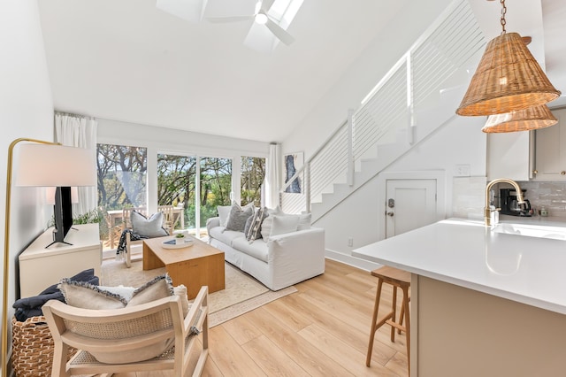 70 N Camp Creek Rd Unit 3, Inlet Beach, FL 32461 - living area with light wood-style floors, stairway, high vaulted ceiling, and a ceiling fan