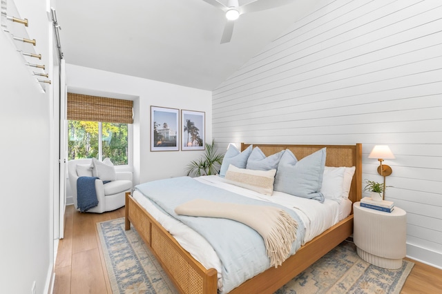 70 N Camp Creek Rd Unit 3, Inlet Beach, FL 32461 - bedroom featuring lofted ceiling, wood walls, light wood-type flooring, and ceiling fan