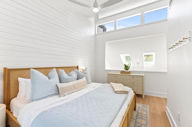 70 N Camp Creek Rd Unit 3, Inlet Beach, FL 32461 - bedroom with light wood finished floors, wood walls, and a high ceiling