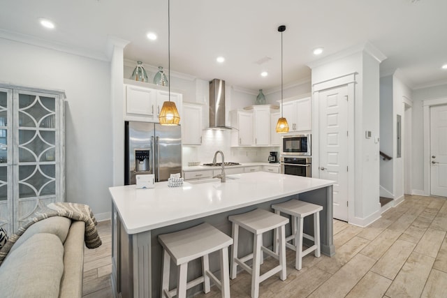 309 Milestone Dr Unit A, Inlet Beach, FL 32461 - kitchen featuring stainless steel appliances, wall chimney range hood, crown molding, decorative backsplash, and white cabinets