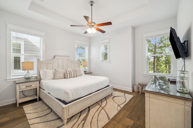 309 Milestone Dr Unit A, Inlet Beach, FL 32461 - bedroom with a raised ceiling and dark wood-type flooring