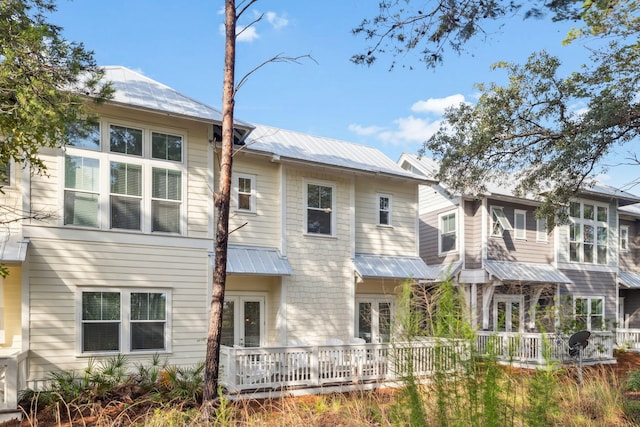 309 Milestone Dr Unit A, Inlet Beach, FL 32461 - back of property with french doors and a metal roof