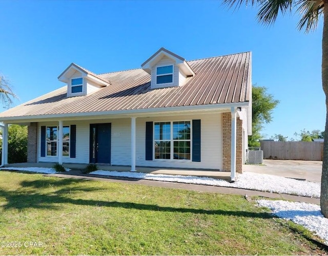 7202 Ranier St, Panama City, FL 32404 - view of front of house with covered porch and a metal roof
