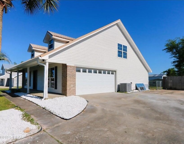 7202 Ranier St, Panama City, FL 32404 - view of side of home featuring a porch, brick siding, and driveway