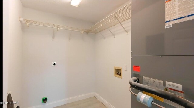 7202 Ranier St, Panama City, FL 32404 - washroom with heating unit, hookup for a washing machine, electric dryer hookup, and wood finished floors