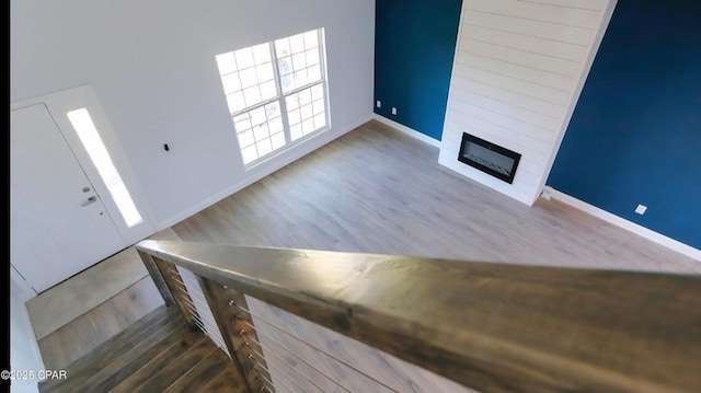 7202 Ranier St, Panama City, FL 32404 - unfurnished living room with wood finished floors and a large fireplace