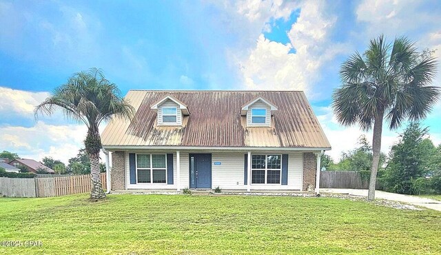 7202 Ranier St, Panama City, FL 32404 - cape cod-style house with covered porch and a metal roof