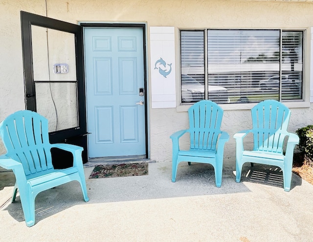 3100 Scenic Highway 98 Unit 118, Destin, FL 32541 - doorway to property with stucco siding
