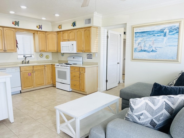 3100 Scenic Highway 98 Unit 118, Destin, FL 32541 - kitchen featuring white appliances, ornamental molding, light countertops, light brown cabinets, and open floor plan