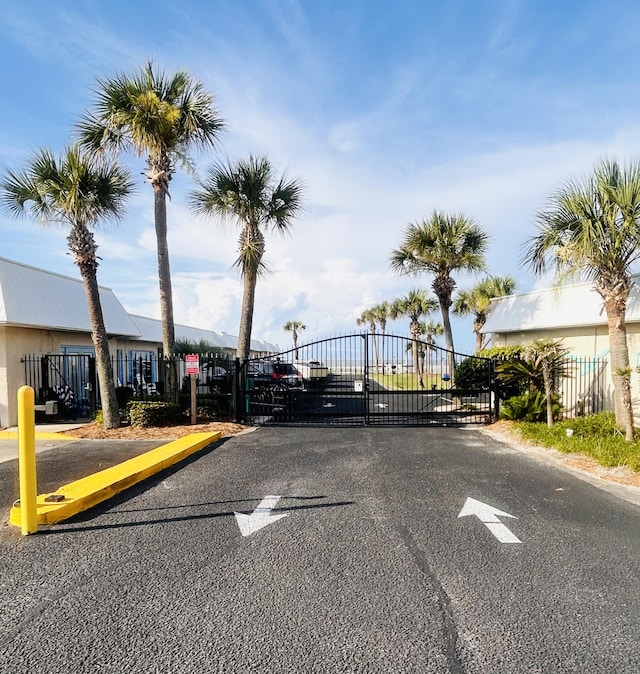 3100 Scenic Highway 98 Unit 118, Destin, FL 32541 - view of asphalt street featuring a gate, a gated entry, and curbs