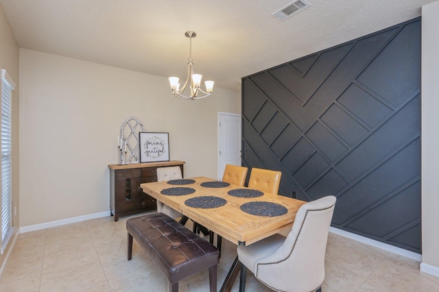 4530 Annabelle Ln, Crestview, FL 32539 - dining room featuring a chandelier and light tile patterned floors