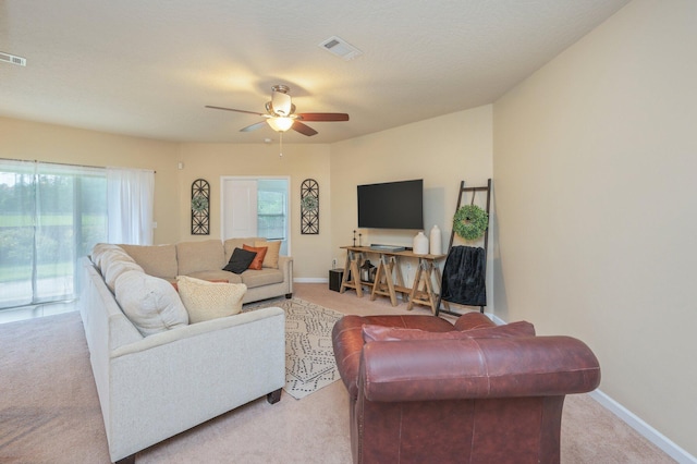 4530 Annabelle Ln, Crestview, FL 32539 - carpeted living area featuring ceiling fan and plenty of natural light