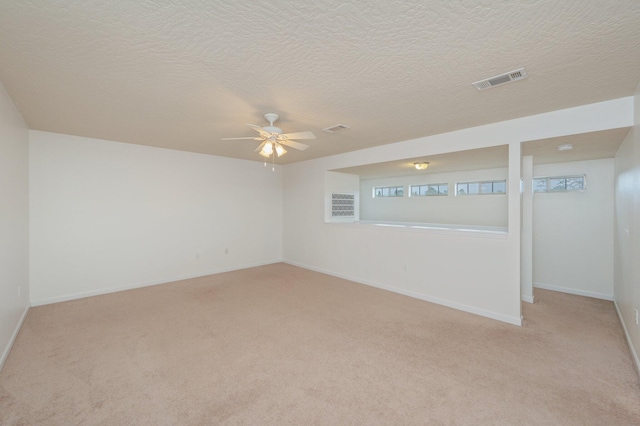 4530 Annabelle Ln, Crestview, FL 32539 - unfurnished room featuring light colored carpet, a ceiling fan, and a textured ceiling