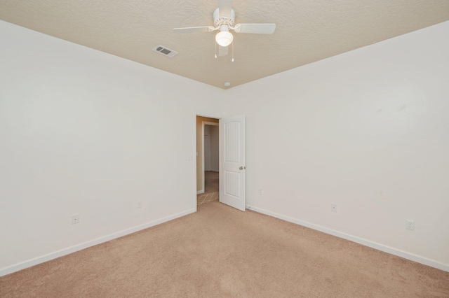 4530 Annabelle Ln, Crestview, FL 32539 - empty room with light colored carpet, ceiling fan, and a textured ceiling