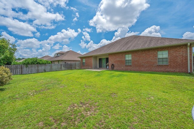 4530 Annabelle Ln, Crestview, FL 32539 - rear view of house featuring brick siding and a patio
