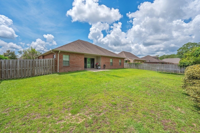 4530 Annabelle Ln, Crestview, FL 32539 - fenced backyard featuring a patio