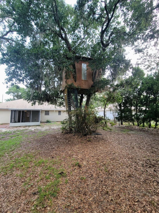 6868 E Bay Blvd, Navarre, FL 32566 - view of yard with a sunroom